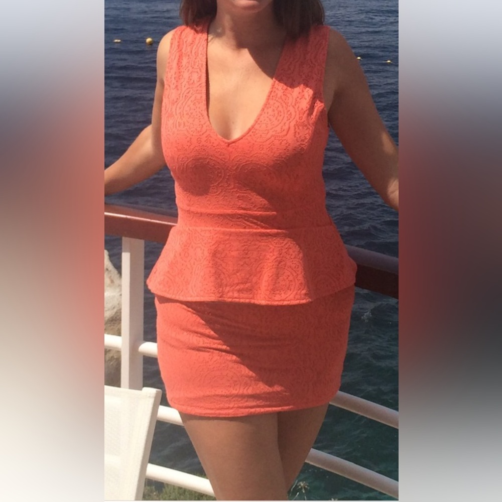Coral pink mini dress with flattering skirt over waist. Easy to hide bra straps